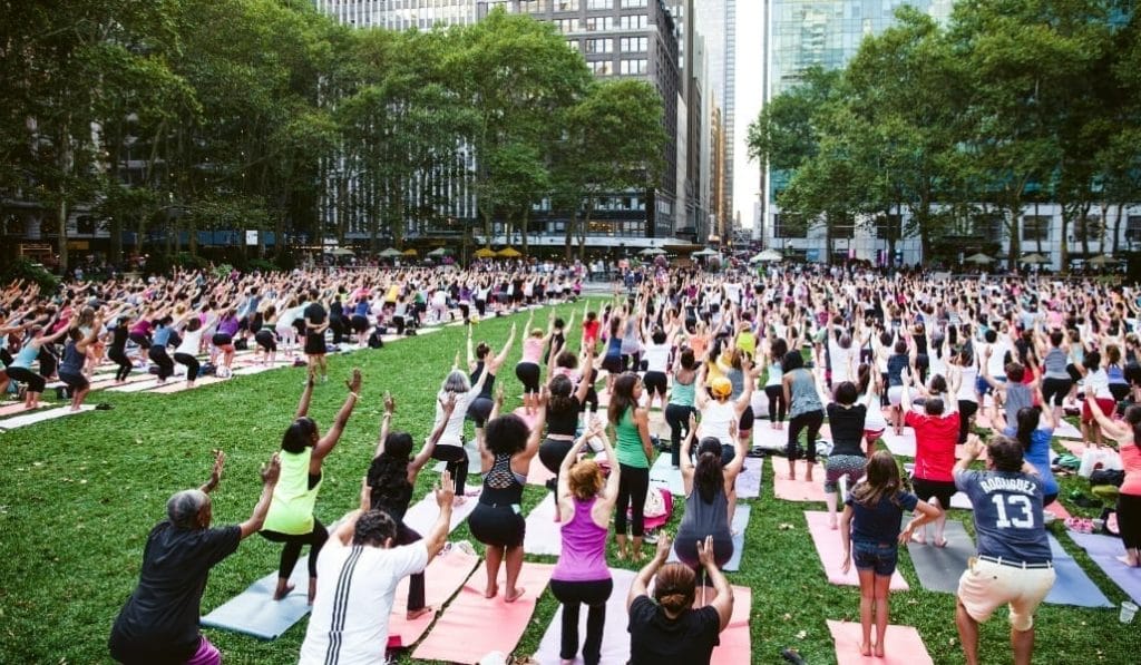 a large crowd partaking in Bryant Park Yoga